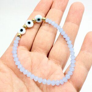Blue Faceted Bead Evil Eye Stretch Bracelet with Gold-Tone Accents